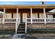 House exterior featuring a covered porch and stonework at 3709 Charlotte Dr, Rex, GA 30273