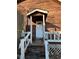 Front entrance with white door and wooden porch at 3709 Charlotte Dr, Rex, GA 30273