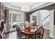 Bright dining room with large windows and view of backyard at 133 Creek Bank Dr, Acworth, GA 30101