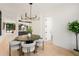 Elegant dining room with a round table and modern chandelier at 194 East Lake Se Ter, Atlanta, GA 30317