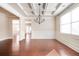 Formal dining room with hardwood floors, chandelier, and wainscoting at 706 Independence Ln, Acworth, GA 30102