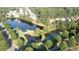 Aerial view of homes surrounding a peaceful lake with lush green trees at 558 Olympic Way, Acworth, GA 30102