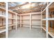 Unfinished basement with built-in storage shelving at 558 Olympic Way, Acworth, GA 30102