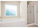 Relaxing bathroom with soaking tub and shower at 558 Olympic Way, Acworth, GA 30102