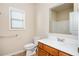 Clean bathroom with wood vanity and shower/tub combo at 558 Olympic Way, Acworth, GA 30102
