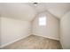Small bedroom with sloped ceilings and carpet at 558 Olympic Way, Acworth, GA 30102