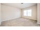 Bright bedroom with neutral walls and carpet at 558 Olympic Way, Acworth, GA 30102