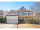 Two-story house with stone accents and a large front yard at 558 Olympic Way, Acworth, GA 30102