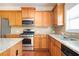 Kitchen features granite countertops and wood cabinets at 558 Olympic Way, Acworth, GA 30102