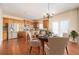 Eat-in kitchen with island, stainless steel appliances, and hardwood floors at 558 Olympic Way, Acworth, GA 30102