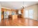 Eat-in kitchen with island, stainless steel appliances, and hardwood floors at 558 Olympic Way, Acworth, GA 30102