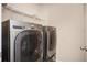 Bright laundry room with LG washer and dryer and ample shelving at 558 Olympic Way, Acworth, GA 30102