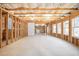 Unfinished basement with exposed framing and windows at 558 Olympic Way, Acworth, GA 30102
