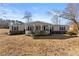 House exterior showcasing front porch and landscaping at 207 Arcado Nw Rd, Lilburn, GA 30047