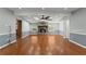 Bright living room featuring hardwood floors, a fireplace, and a ceiling fan at 207 Arcado Nw Rd, Lilburn, GA 30047