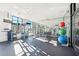 Well-equipped fitness center with modern equipment, mirrored walls, and ample natural light for workouts at 2277 Peachtree Ne Rd # 405, Atlanta, GA 30309