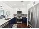 Modern kitchen features white cabinetry, stainless steel appliances, and white countertops at 2277 Peachtree Ne Rd # 405, Atlanta, GA 30309