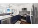 Modern kitchen features white cabinetry, stainless steel appliances, and white countertops at 2277 Peachtree Ne Rd # 405, Atlanta, GA 30309