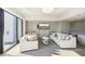 A light-filled modern living room with large windows and comfortable seating at 2277 Peachtree Ne Rd # 405, Atlanta, GA 30309