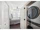 Main bedroom with ensuite laundry through white doors, featuring a modern ceiling fan at 2277 Peachtree Ne Rd # 405, Atlanta, GA 30309
