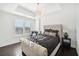 Beautiful main bedroom features tray ceilings, plantation shutters, hardwood floors and modern light fixtures at 2277 Peachtree Ne Rd # 405, Atlanta, GA 30309