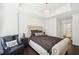 This spacious main bedroom features a tray ceiling, a large window and an upholstered headboard at 2277 Peachtree Ne Rd # 405, Atlanta, GA 30309