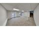 Finished basement with carpet, built-in storage, and double doors leading outside at 368 Sumer Ln, Douglasville, GA 30134