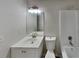 Updated bathroom with white vanity, modern fixtures, and a bathtub at 368 Sumer Ln, Douglasville, GA 30134