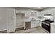 Modern kitchen with white cabinets, stainless steel appliances, and quartz countertops at 368 Sumer Ln, Douglasville, GA 30134