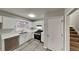 Modern kitchen with white cabinets, stainless steel appliances, and quartz countertops at 368 Sumer Ln, Douglasville, GA 30134