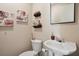 Small bathroom with pedestal sink and decorative accents at 17 Ivy Gates Ne, Atlanta, GA 30342