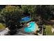 An aerial view of a kidney-shaped swimming pool and tennis court at 17 Ivy Gates Ne, Atlanta, GA 30342