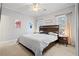 Main bedroom with king-size bed, ceiling fan and ample closet space at 1709 Bald Ridge Marina Rd # 4, Cumming, GA 30041