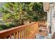 Deck with wooden railings, offering a peaceful wooded view at 1709 Bald Ridge Marina Rd # 4, Cumming, GA 30041