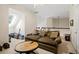 Comfortable living room area with brown sofa, round wood table and natural light from the skylight at 1709 Bald Ridge Marina Rd # 4, Cumming, GA 30041