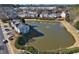 Aerial view of neighborhood with pond at 1761 Stanwood Nw Dr, Kennesaw, GA 30152