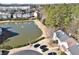 Aerial view of homes and a pond with fountain at 1761 Stanwood Nw Dr, Kennesaw, GA 30152