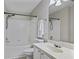 Clean bathroom with a tub, shower, and white vanity at 1761 Stanwood Nw Dr, Kennesaw, GA 30152