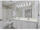 Bathroom with double vanity, neutral walls, and tiled shower/tub at 1761 Stanwood Nw Dr, Kennesaw, GA 30152