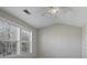 Bedroom with vaulted ceiling, neutral walls and multiple windows at 1761 Stanwood Nw Dr, Kennesaw, GA 30152