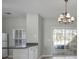 Eat-in kitchen with white cabinets, gray countertops, and sliding glass doors at 1761 Stanwood Nw Dr, Kennesaw, GA 30152