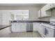 Eat-in kitchen with stainless steel dishwasher and gas range at 1761 Stanwood Nw Dr, Kennesaw, GA 30152