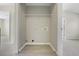 Laundry closet with shelving and hookups for washer and dryer at 1761 Stanwood Nw Dr, Kennesaw, GA 30152