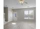 Spacious living room with light gray walls and wood-look flooring at 1761 Stanwood Nw Dr, Kennesaw, GA 30152