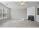 Living room featuring hardwood floors and a corner fireplace at 1761 Stanwood Nw Dr, Kennesaw, GA 30152