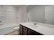 Bathroom features vanity with dark brown cabinets and white countertop at 4331 Portsbrook Ave, Snellville, GA 30039