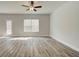 Bright living room with hardwood floors and backyard access at 4331 Portsbrook Ave, Snellville, GA 30039