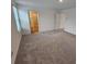 Large bedroom with wall-to-wall carpet and an attached closet at 771 Gelderland Dr, Hampton, GA 30228