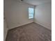 Well-lit bedroom featuring neutral walls and carpet at 771 Gelderland Dr, Hampton, GA 30228