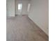 Spacious bedroom with neutral carpeting and an abundance of natural light at 771 Gelderland Dr, Hampton, GA 30228